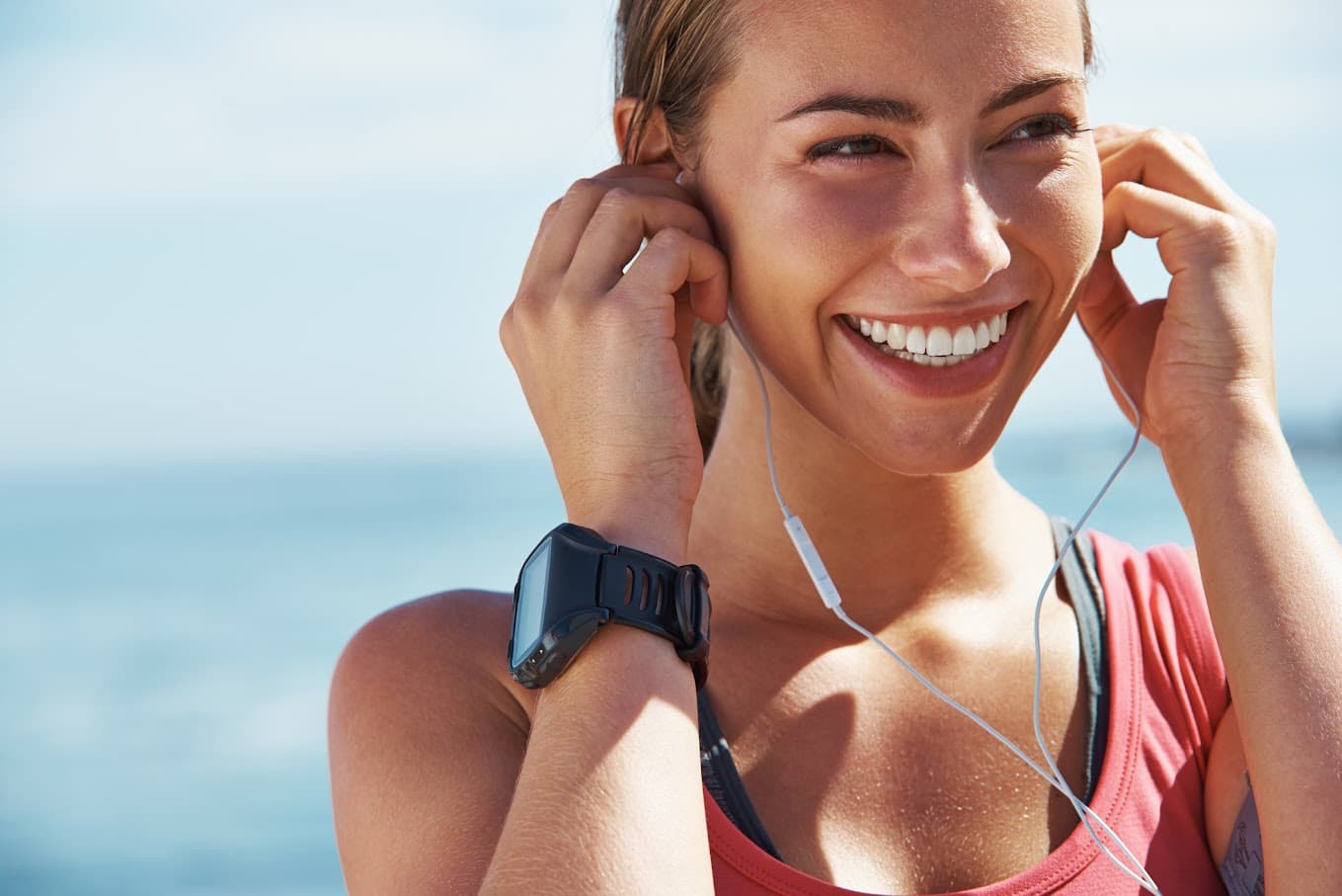 Woman with bright white smile outdoors