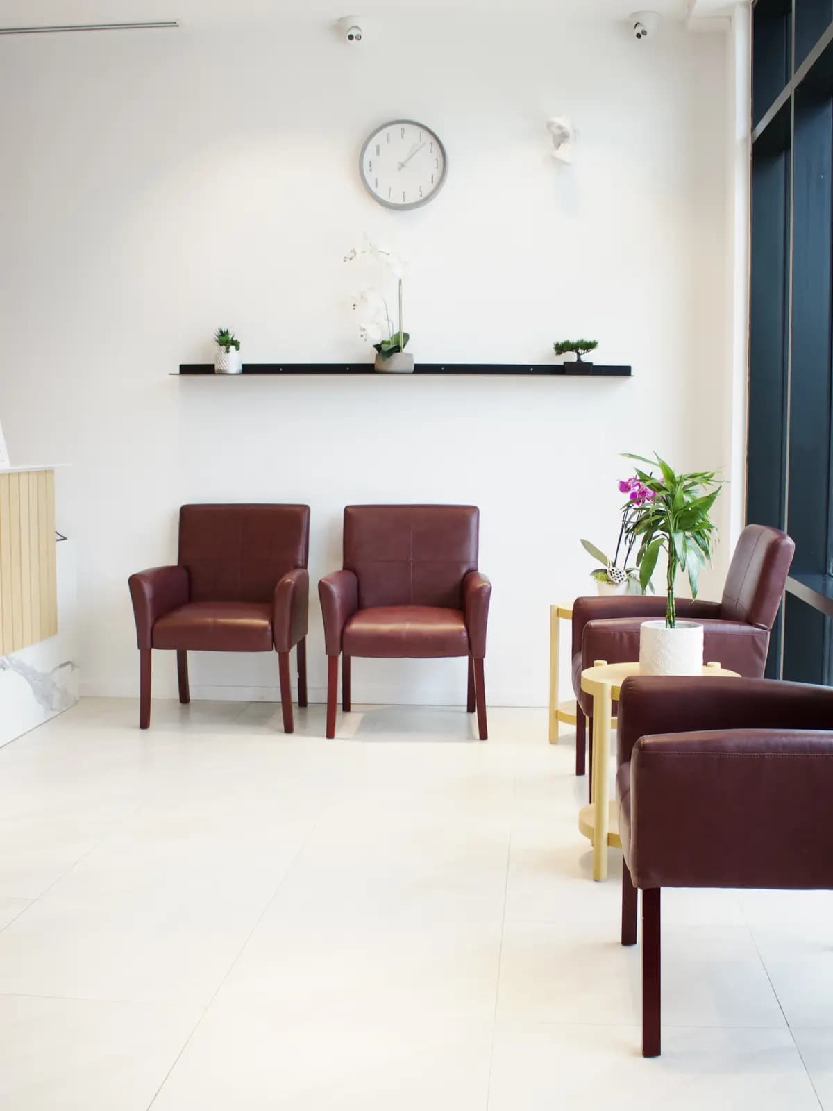 The bright, window-lit waiting lounge at Copperhills Family Dentistry