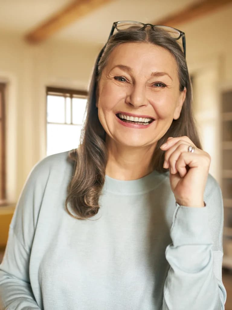 Smiling senior woman with a confident, restored smile