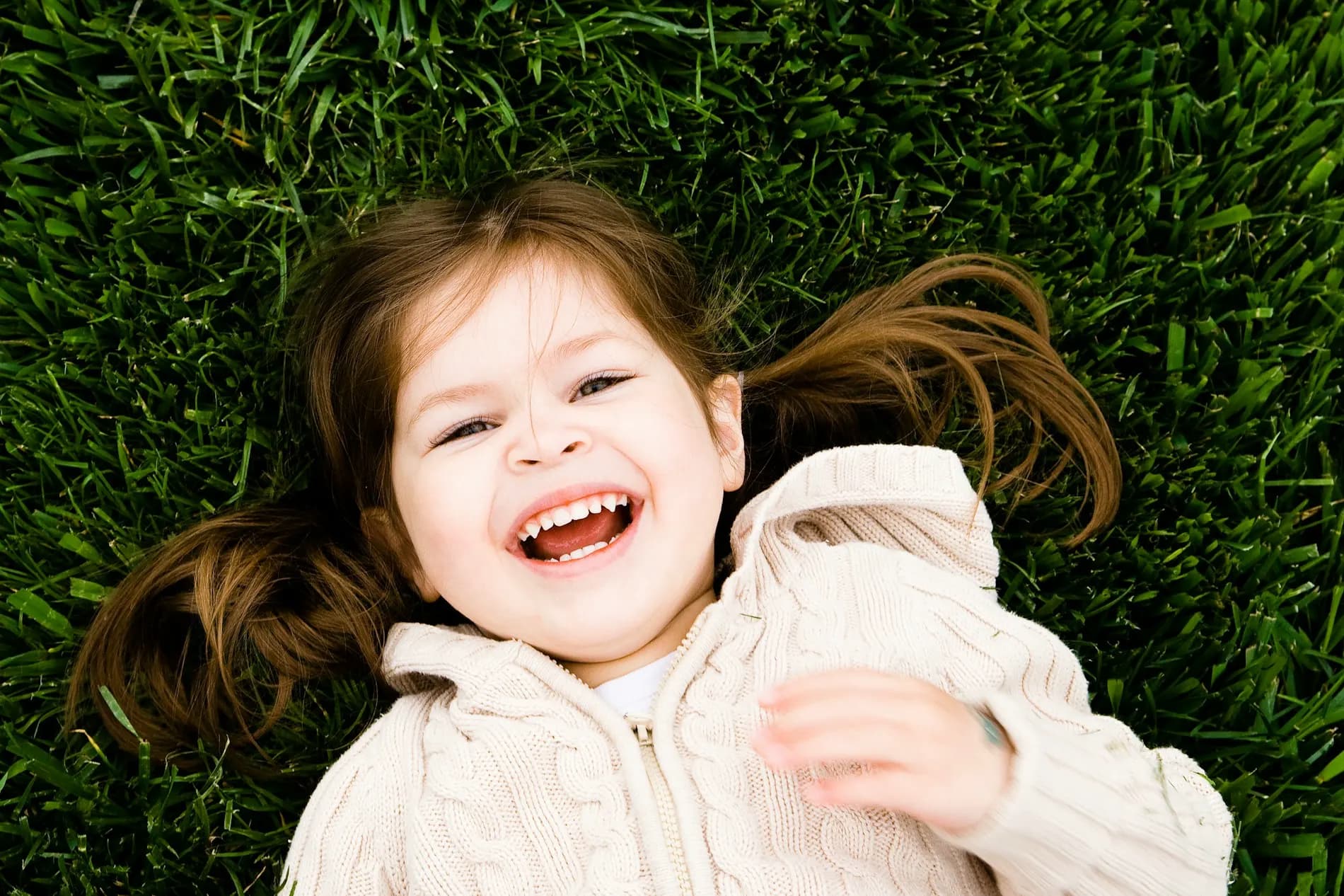 Young girl smiling brightly with healthy teeth